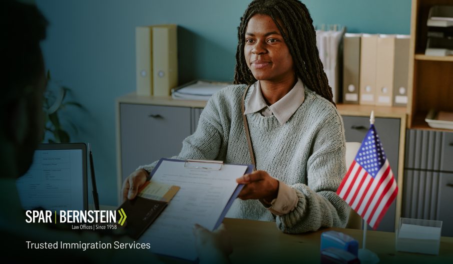 A woman at an immigration interview Caption: The usual timeframe for a decision on your case after an interview is 120 days