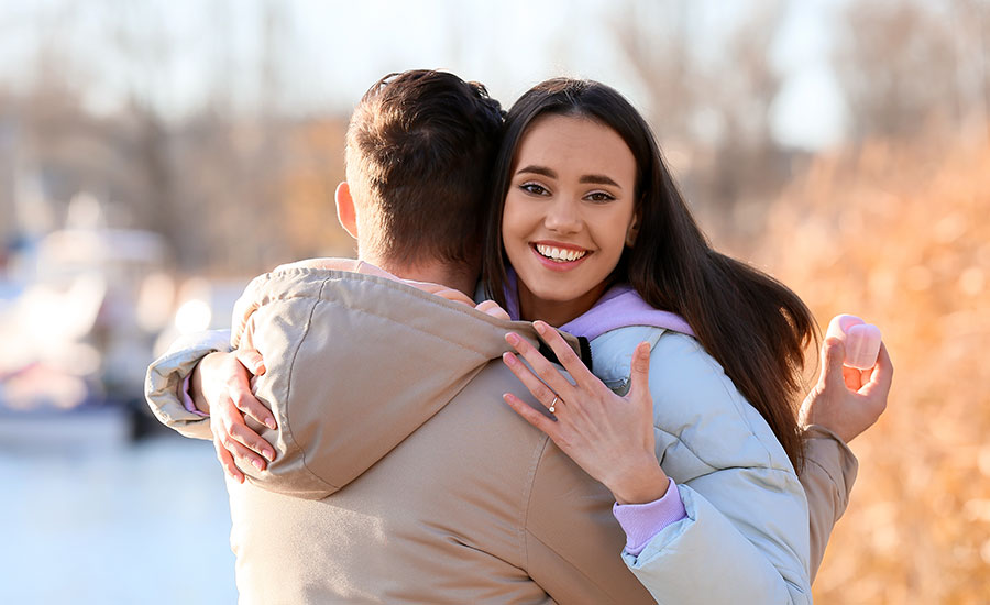 Two young people embracing