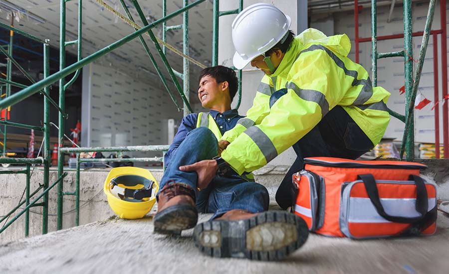 An injured worker on a construction site​