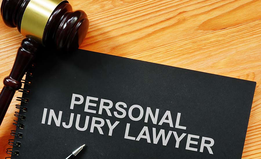 A notebook with a sign saying "Personal injury lawyer