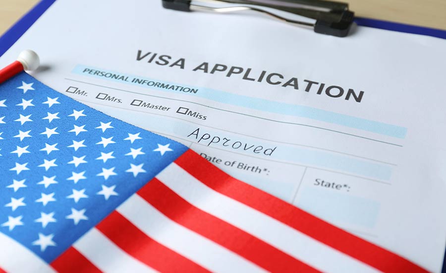 A visa application and the American flag​