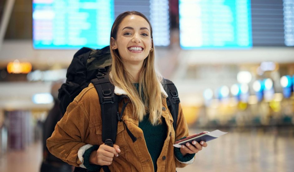 A smiling woman at the airport