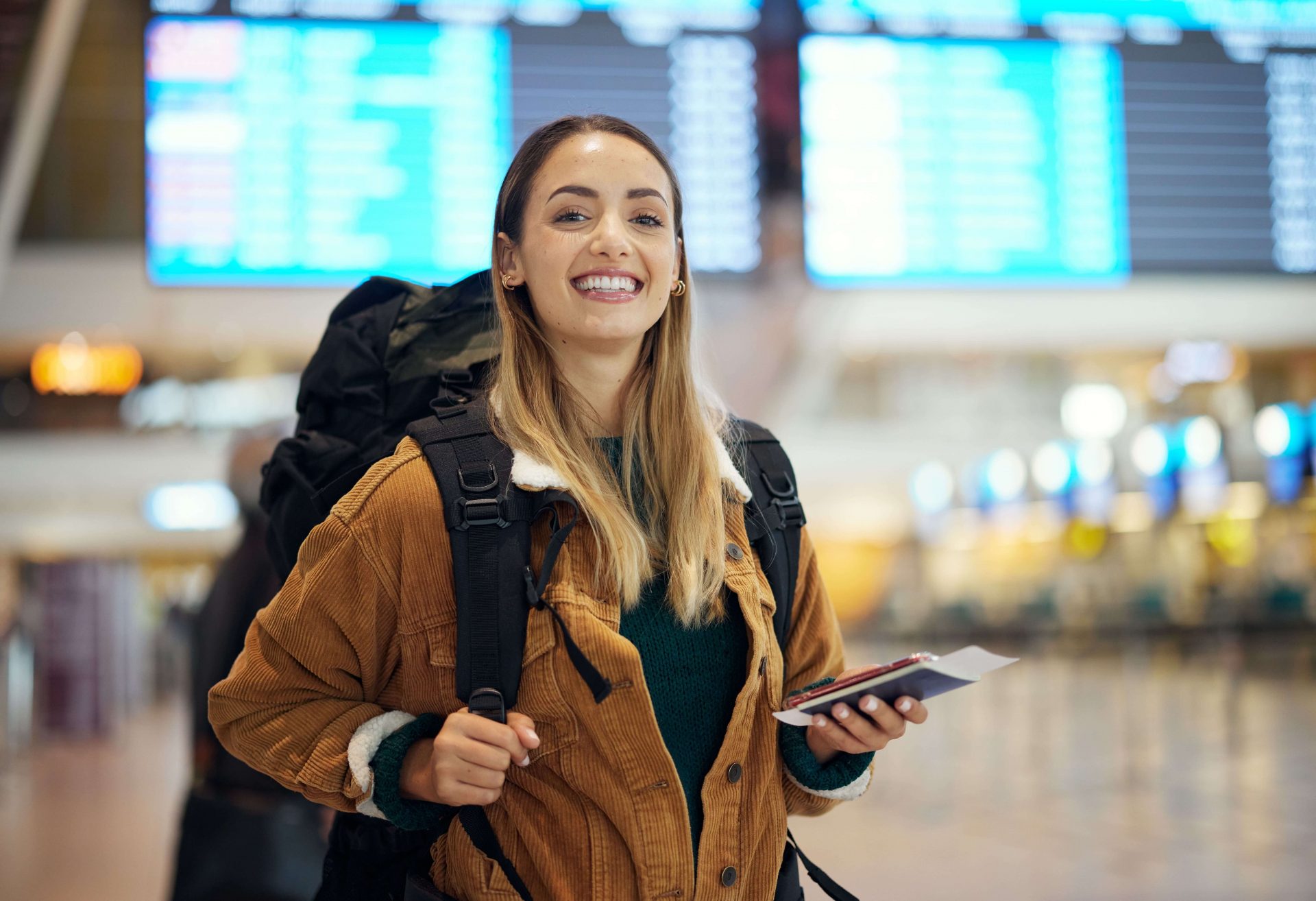 A smiling woman at the airport