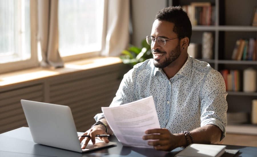 A man in front of his laptop​