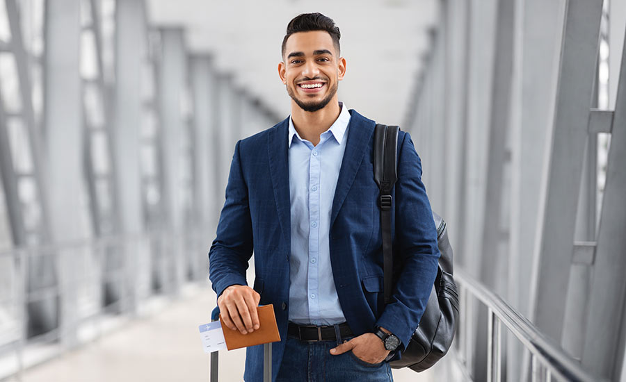 A young smiling man at the airport​