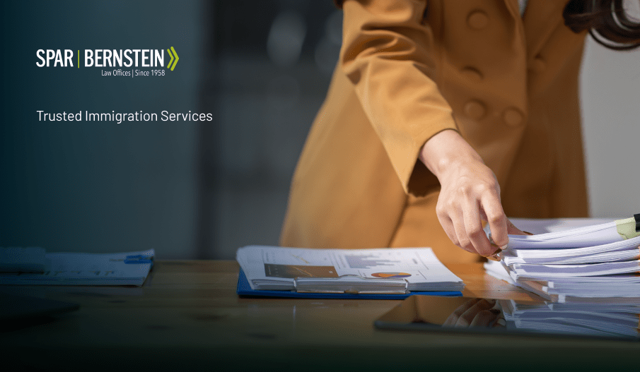 An employer with documents on their desk