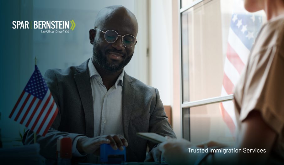 An official putting a visa stamp on documents