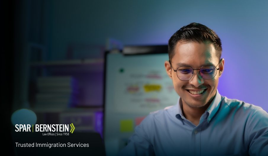 An Asian businessman sitting at a desk